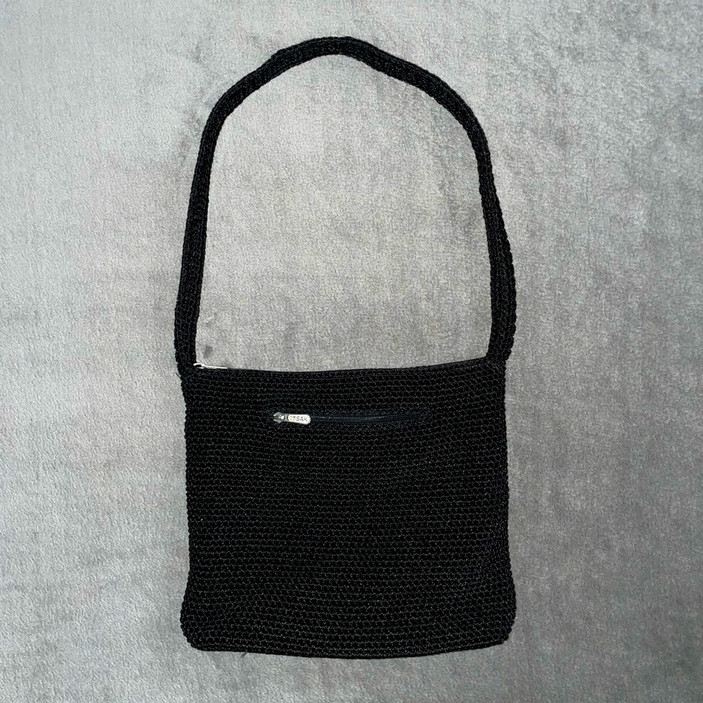 The Sak crocheted black shoulder bag with two zippered pockets